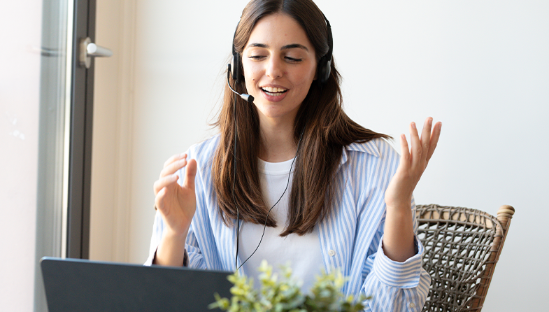 woman at computer with headset and mic