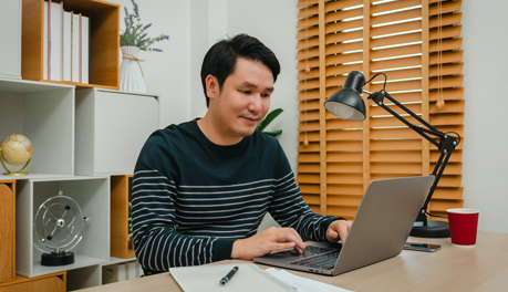 person using computer at desk